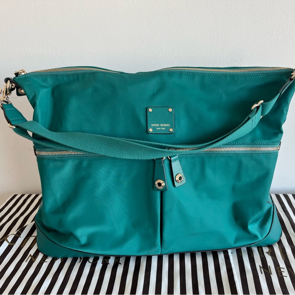 Henri Bendel teal duffel travel bag